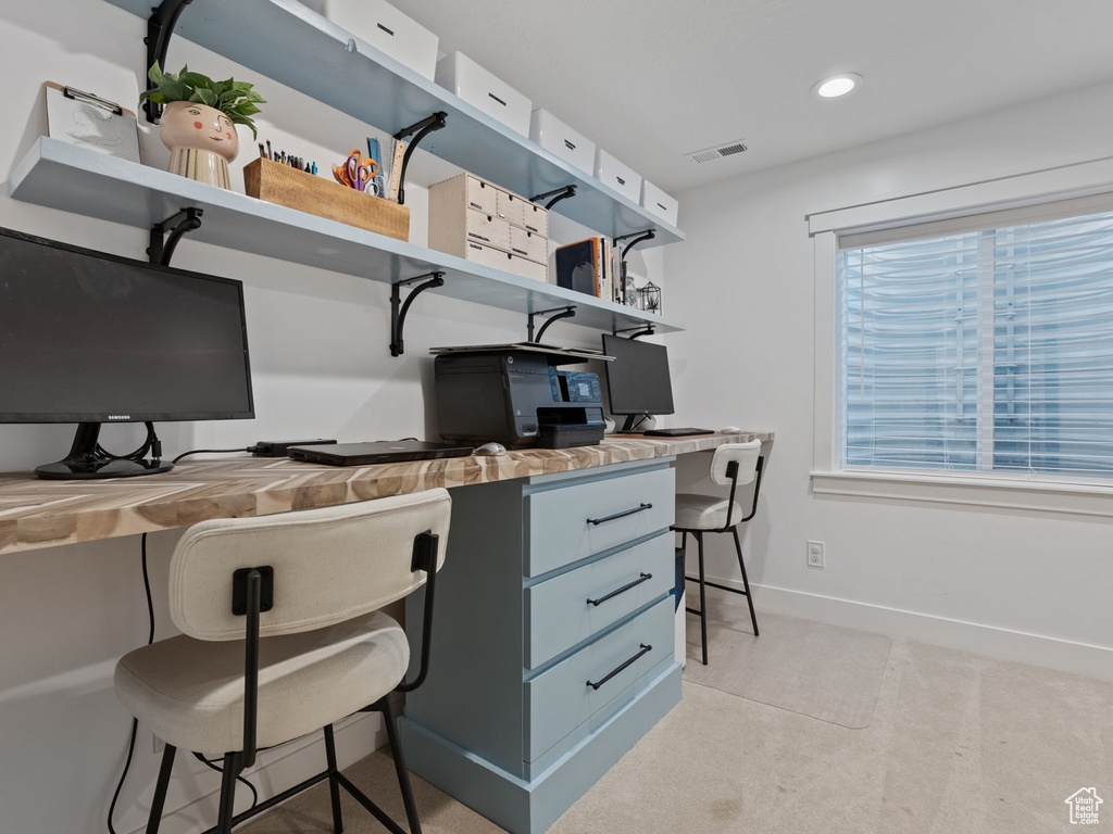 Office area featuring a healthy amount of sunlight, baseboards, and visible vents