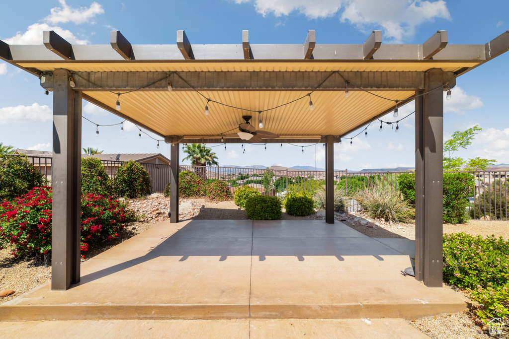 View of patio featuring a ceiling fan and a fenced backyard