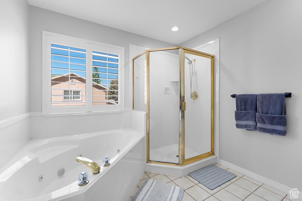 Bathroom with recessed lighting, tile patterned floors, a shower stall, and a tub with jets