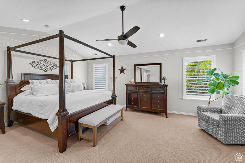 Bedroom featuring light colored carpet, lofted ceiling with beams, recessed lighting, baseboards, and visible vents