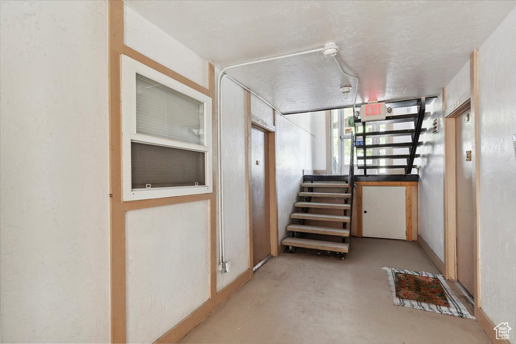 Corridor with concrete floors and stairs