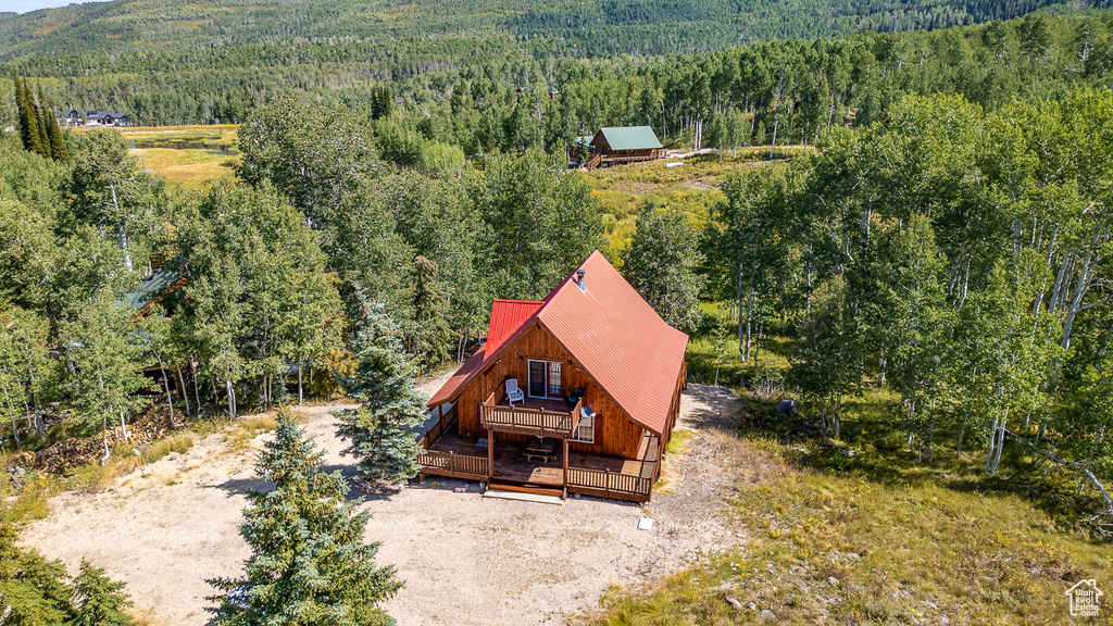 Aerial view featuring a view of trees