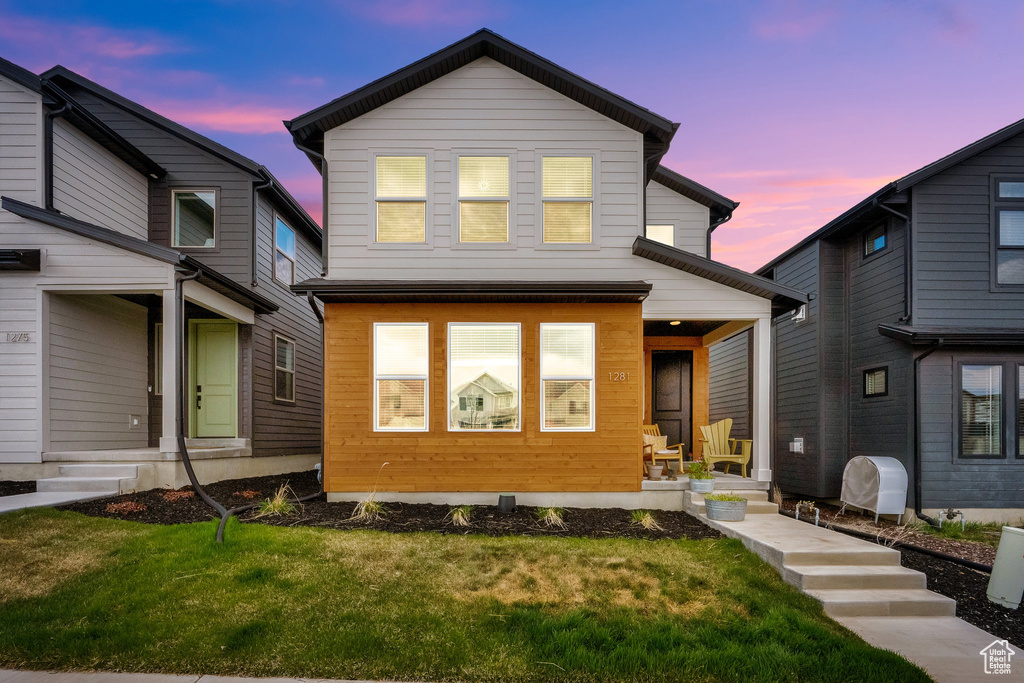 Exterior space with a lawn and a porch
