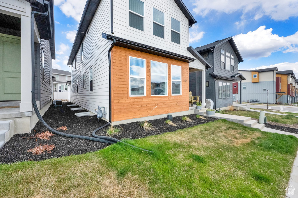 View of home's exterior with a lawn