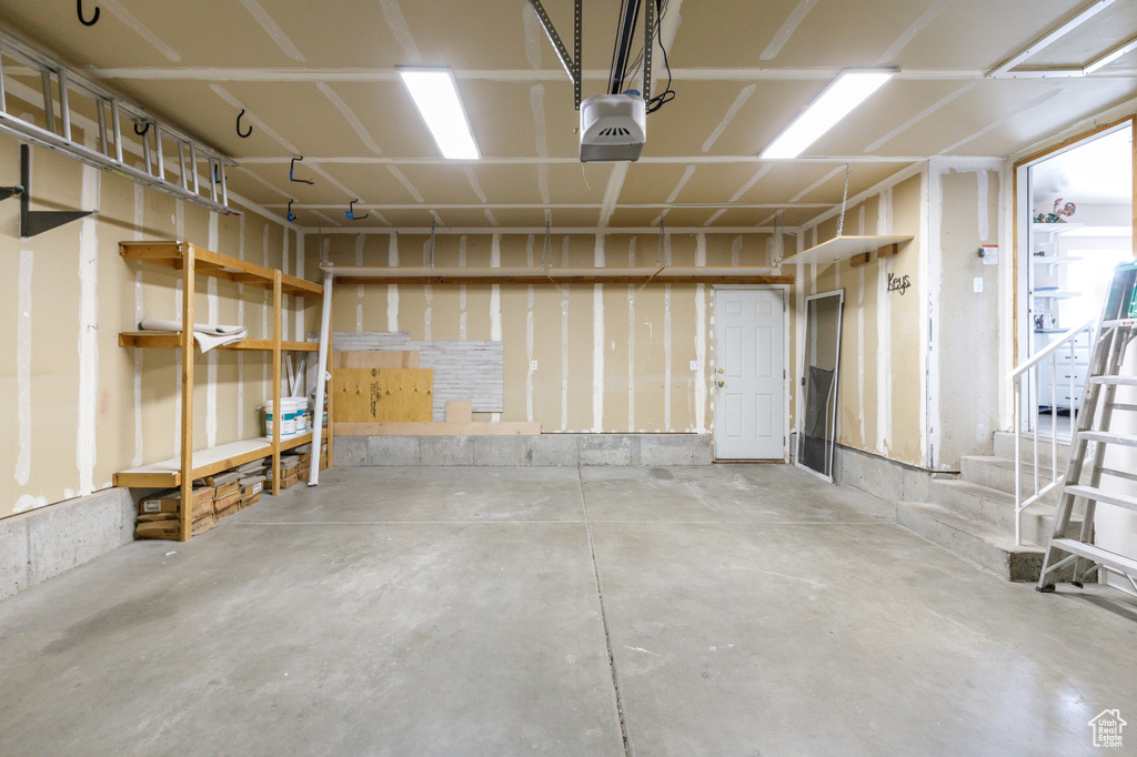 Garage featuring a garage door opener