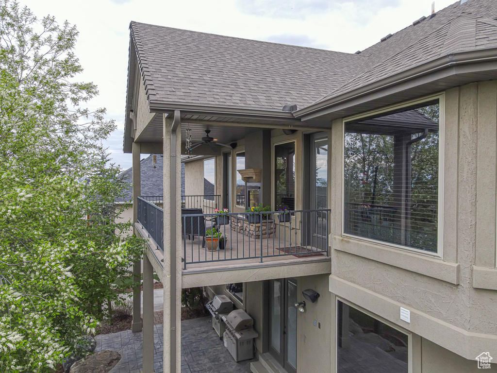 Exterior space featuring area for grilling and ceiling fan
