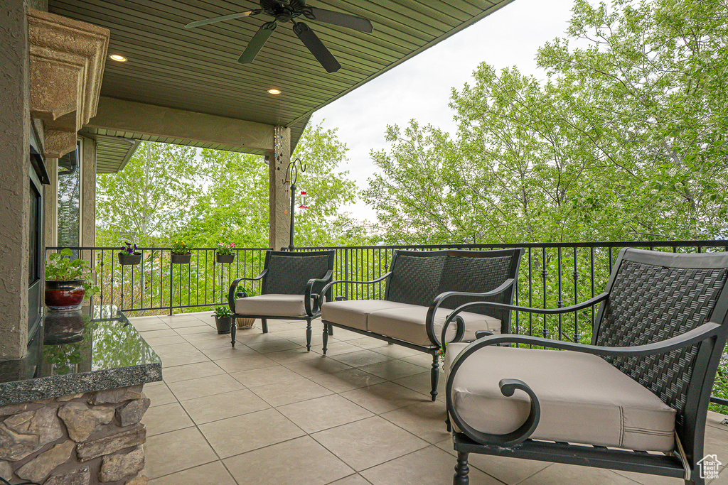 View of patio featuring ceiling fan