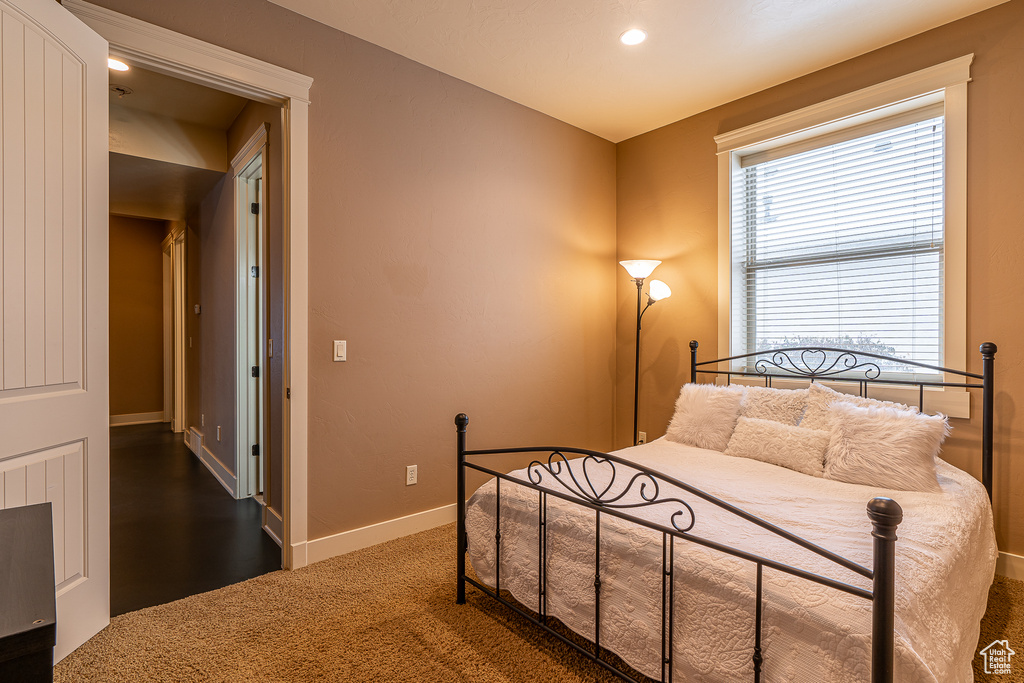 Carpeted bedroom featuring baseboards and recessed lighting