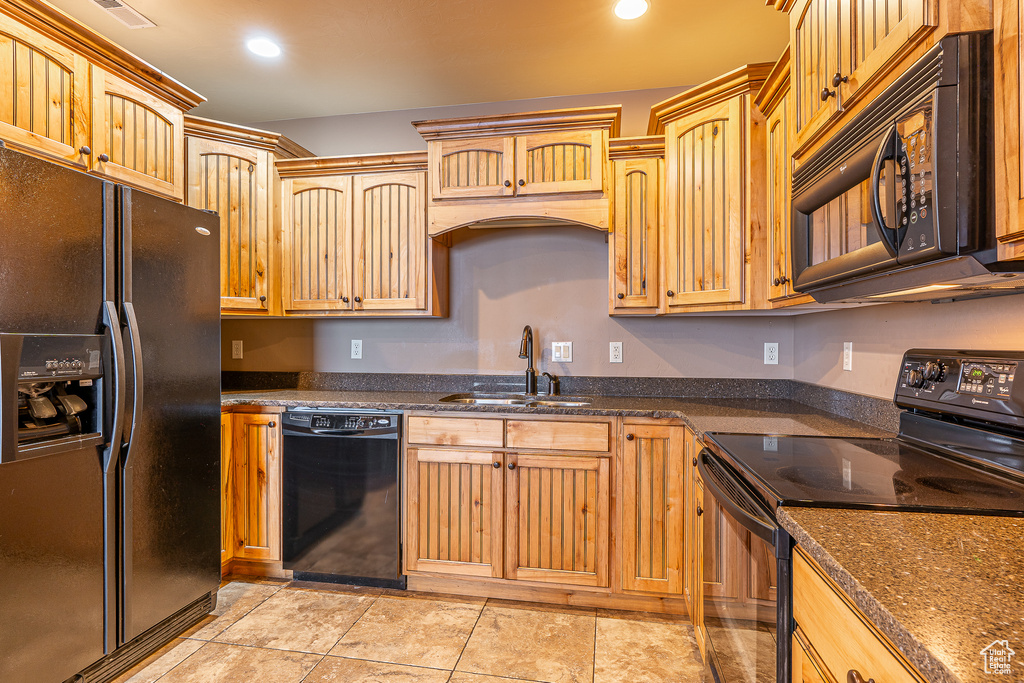 Kitchen featuring a sink, black appliances, visible vents, and recessed lighting