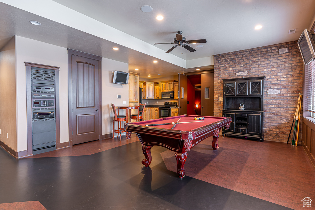 Game room featuring pool table, recessed lighting, ceiling fan, brick wall, and baseboards