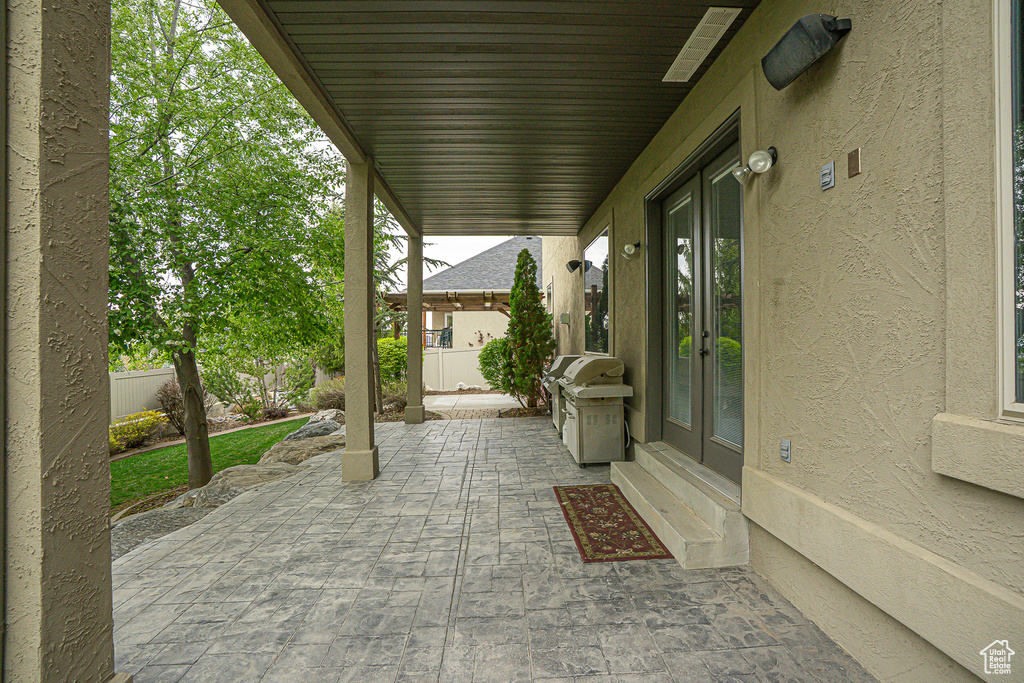 View of patio / terrace with grilling area, fence, and french doors