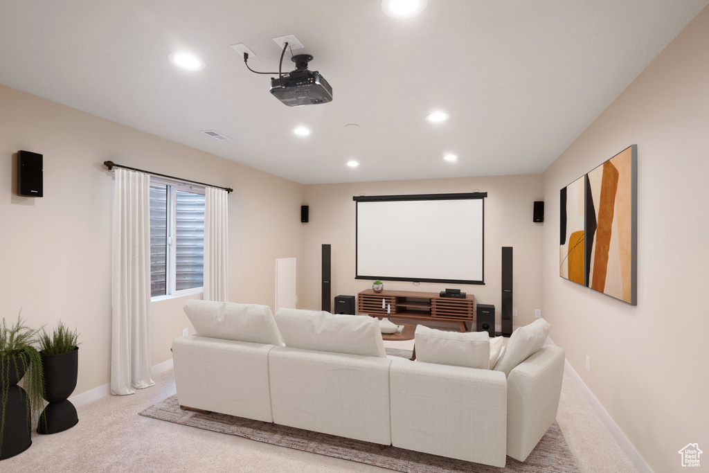 Home theater with light carpet, baseboards, visible vents, and recessed lighting