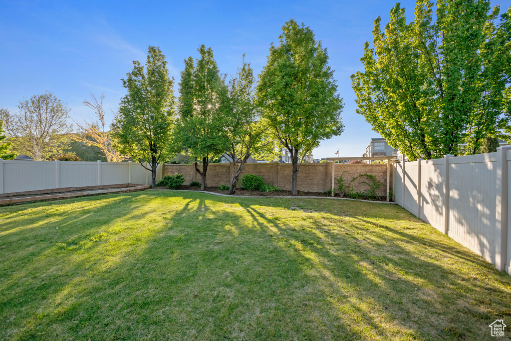 View of yard with a fenced backyard