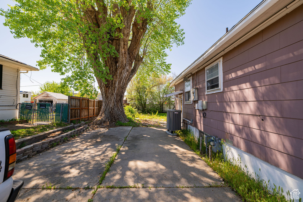 View of patio featuring fence and central AC