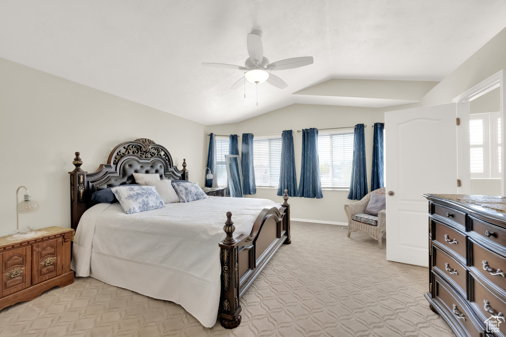 Bedroom with ceiling fan and vaulted ceiling