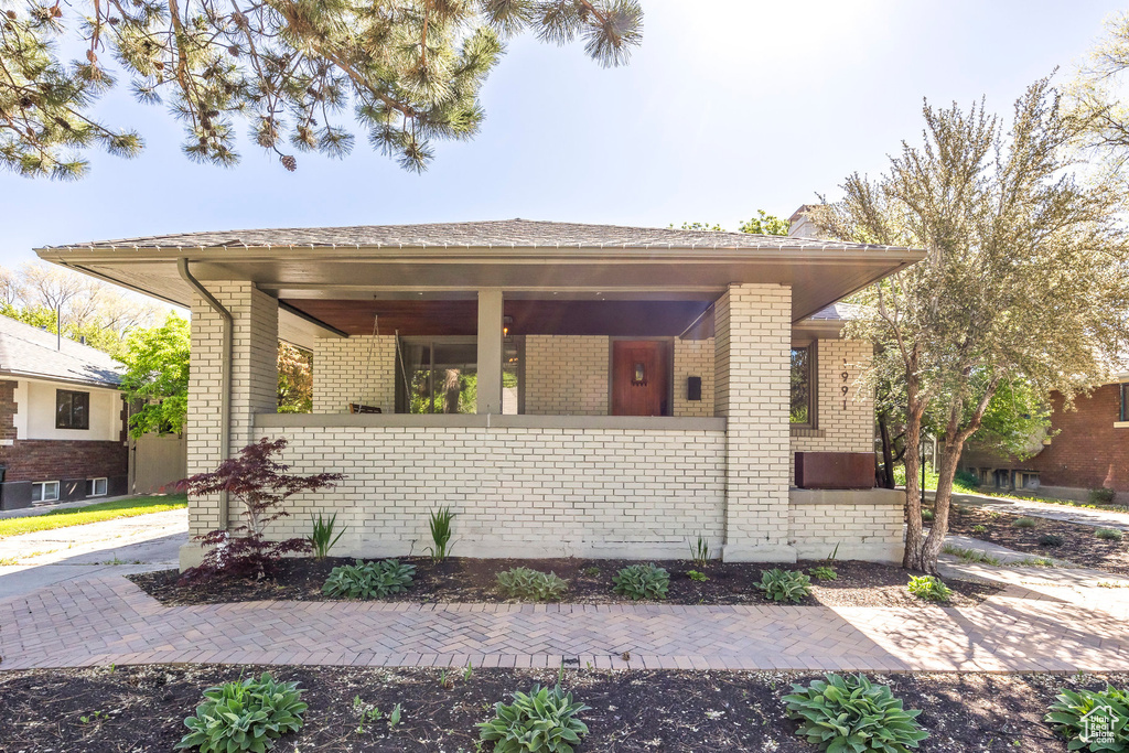 Single story home with brick siding