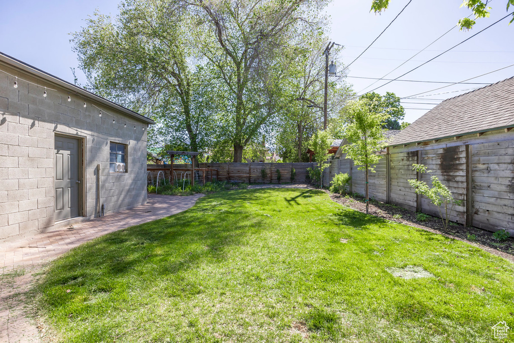 View of yard featuring a fenced backyard
