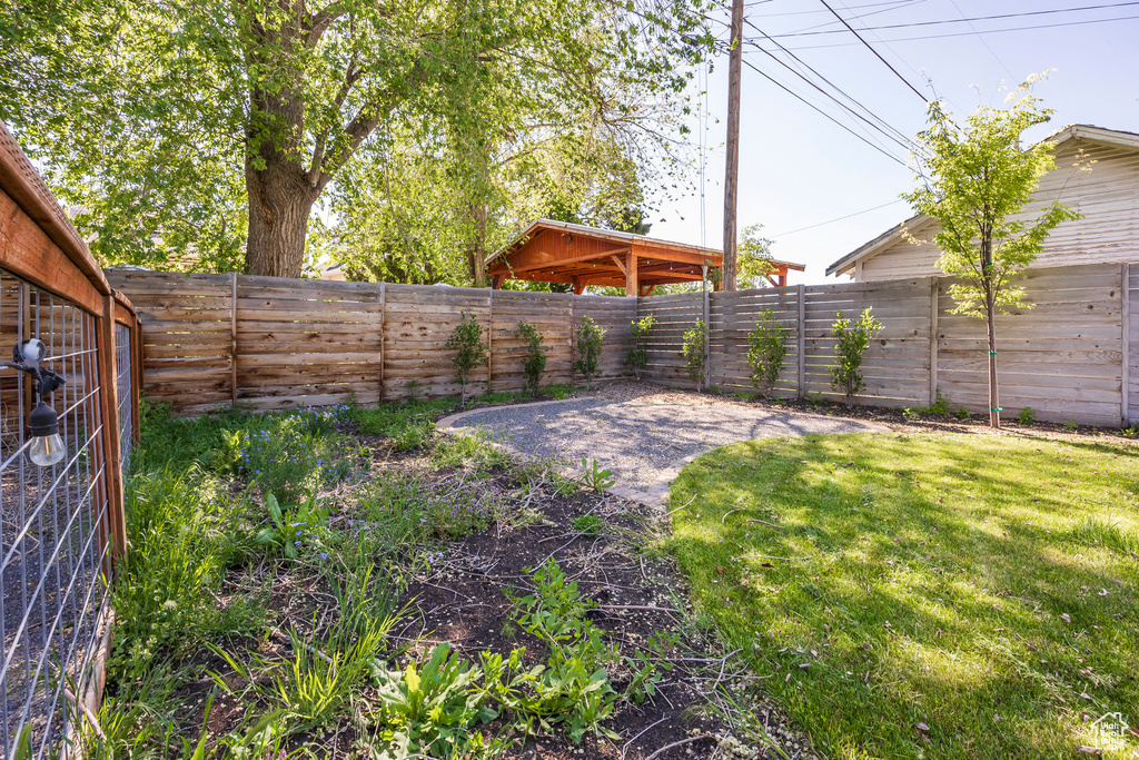View of yard with a patio and a fenced backyard