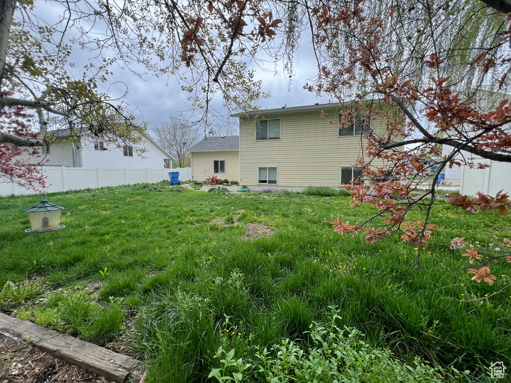 View of yard featuring fence
