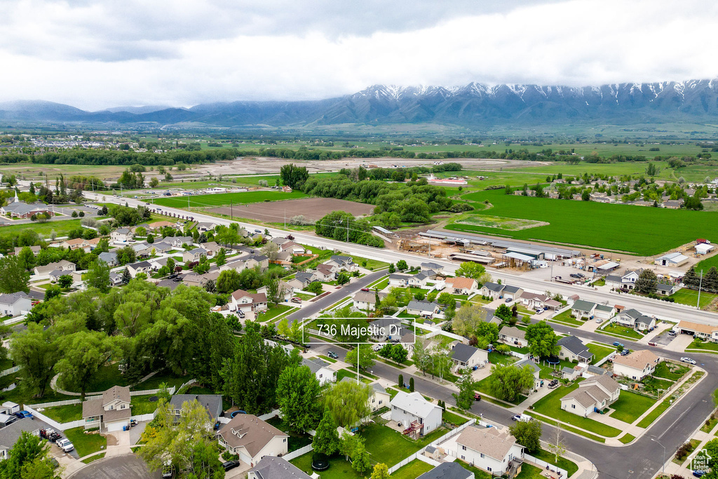Aerial view of residential area featuring a mountain backdrop