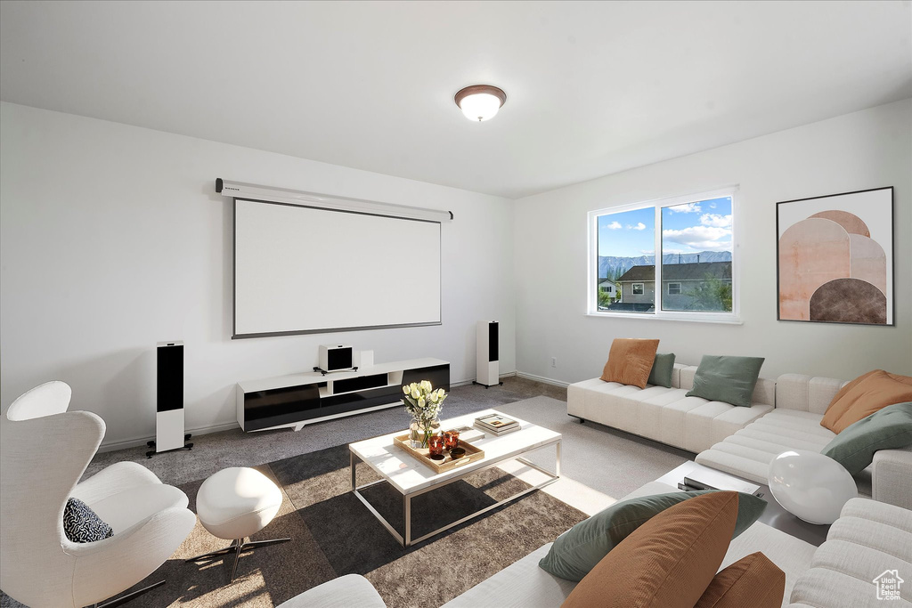 Carpeted cinema room featuring baseboards