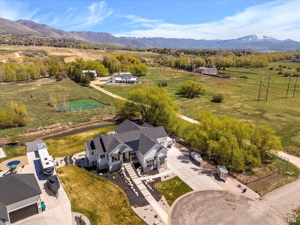 Birds eye view of property with a rural view and a mountain view