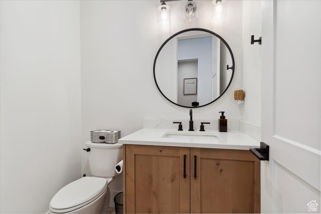 Half bath with toilet and vanity