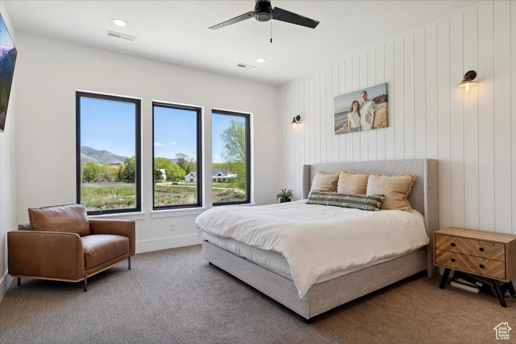Carpeted bedroom with baseboards, a ceiling fan, visible vents, and recessed lighting