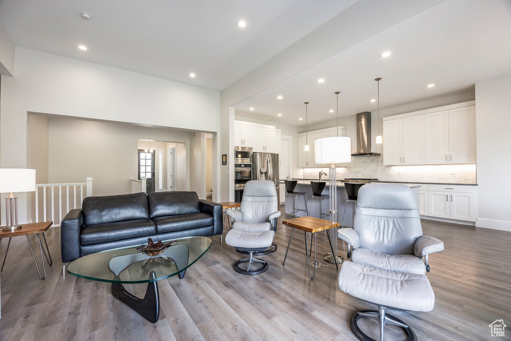 Living area with recessed lighting and wood finished floors