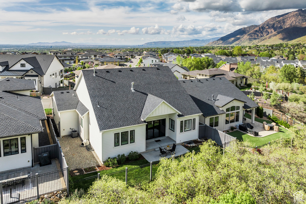 Drone / aerial view featuring a mountain view and a residential view