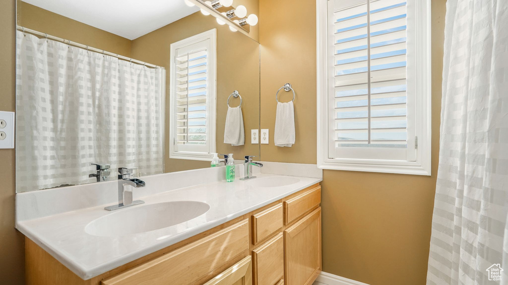 Full bath with a sink and double vanity