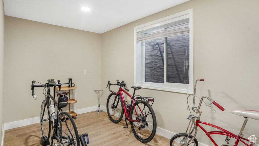 Interior space featuring baseboards and light wood-style flooring