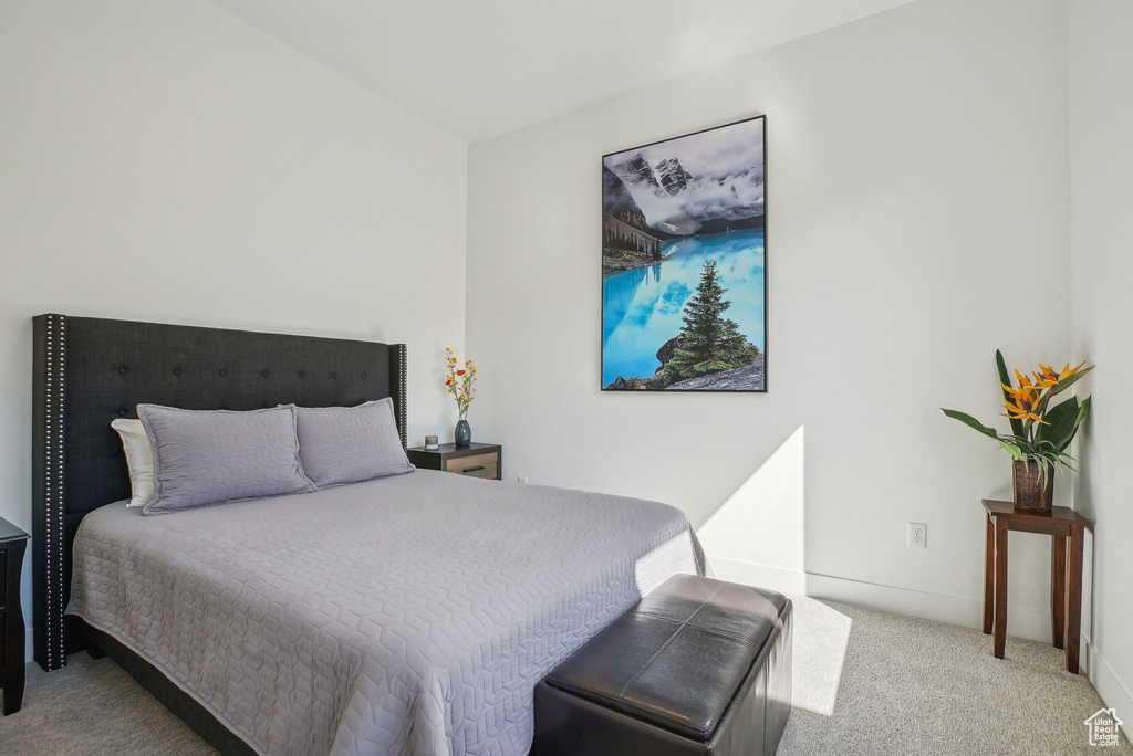 Carpeted bedroom with baseboards