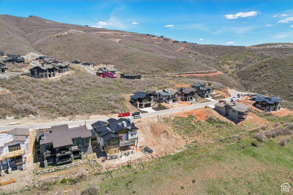 Drone / aerial view with a residential view and a mountain view