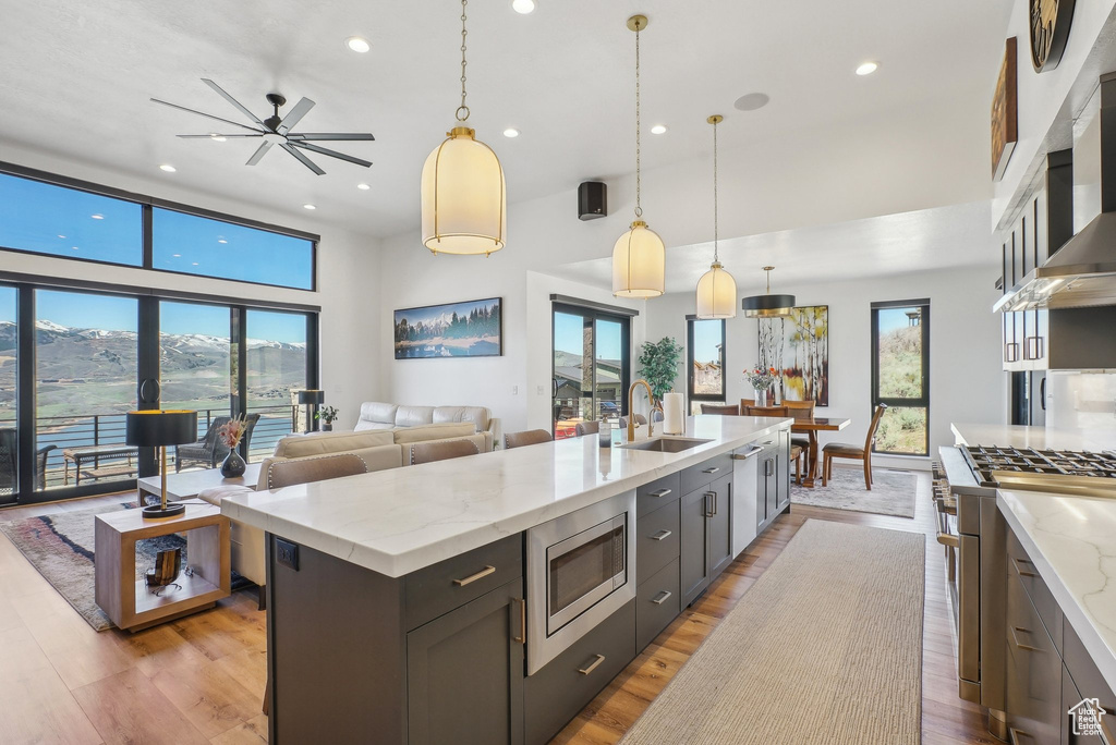 Kitchen featuring recessed lighting, plenty of natural light, stainless steel appliances, and a sink