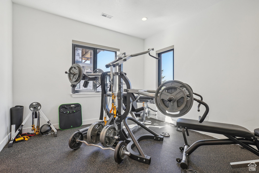 Workout room featuring baseboards and visible vents