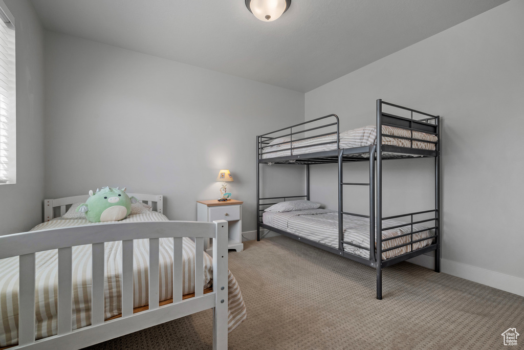 Carpeted bedroom with baseboards