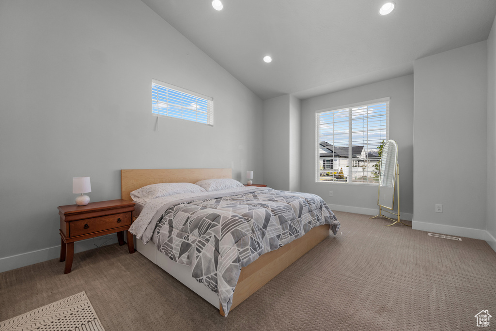 Bedroom featuring baseboards, carpet flooring, recessed lighting, and lofted ceiling