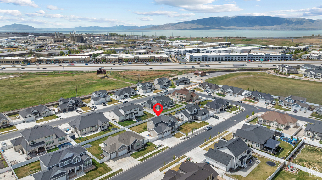 Birds eye view of property featuring a water and mountain view