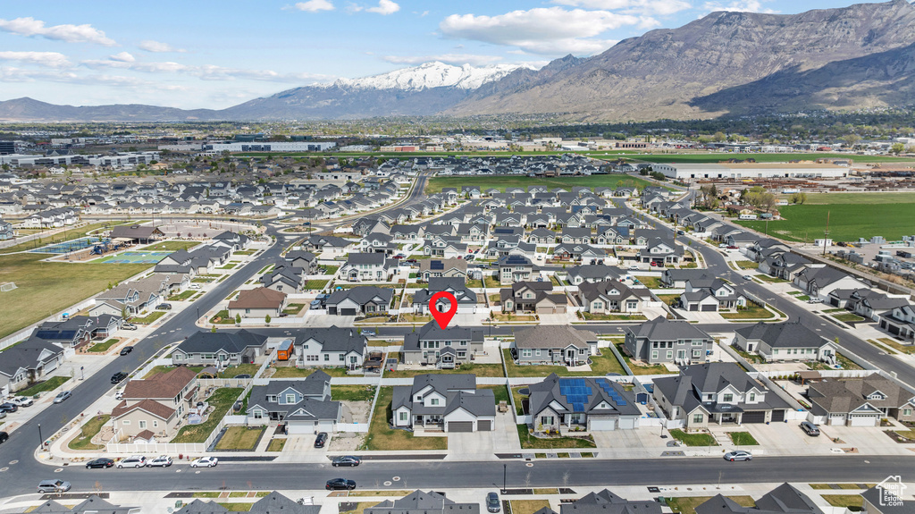 Birds eye view of property with a residential view and a mountain view