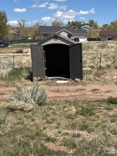 View of shed with fence