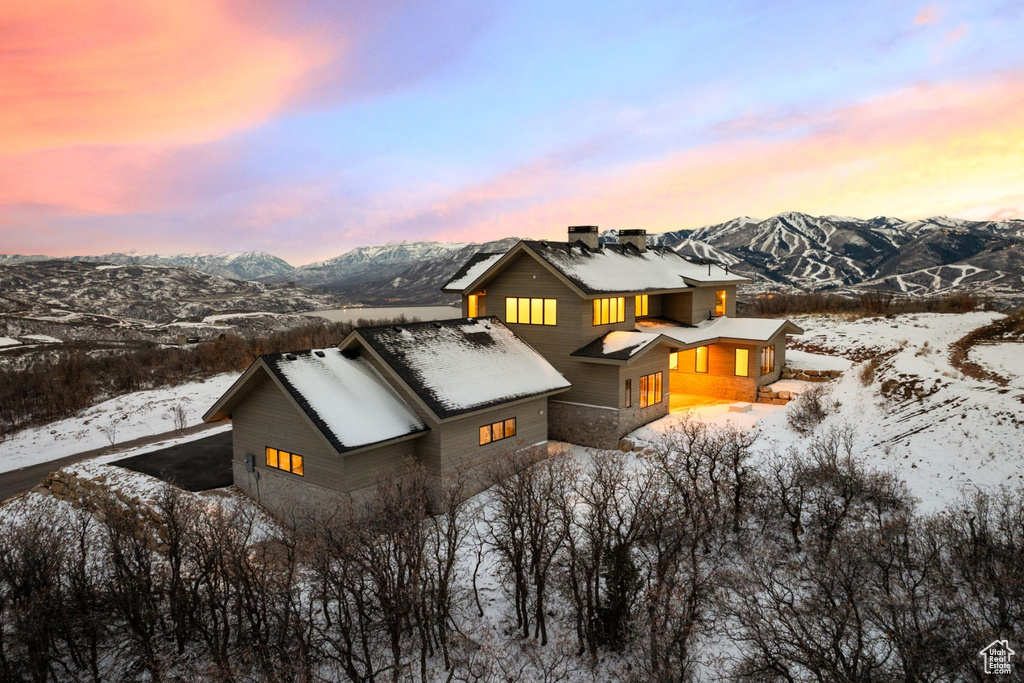 Snowy aerial view with a mountain view