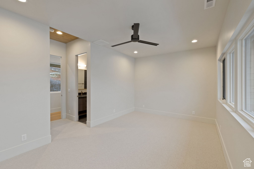 Spare room featuring ceiling fan, carpet flooring, recessed lighting, and visible vents
