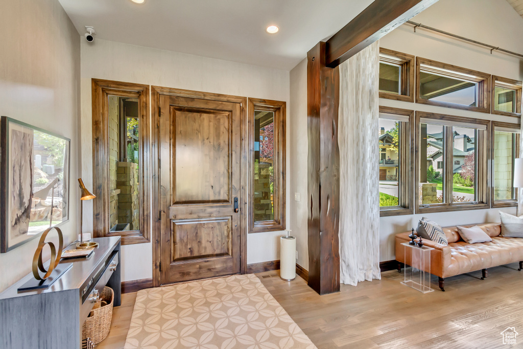 Entryway with light wood-type flooring, recessed lighting, and baseboards