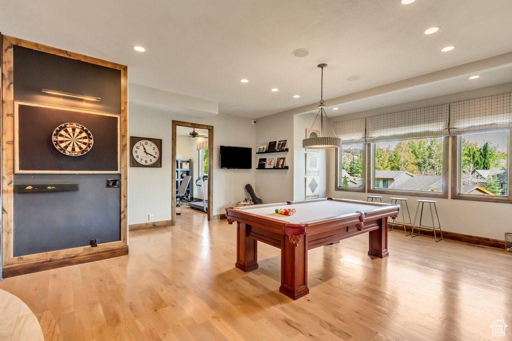 Recreation room featuring recessed lighting, baseboards, and light wood-type flooring