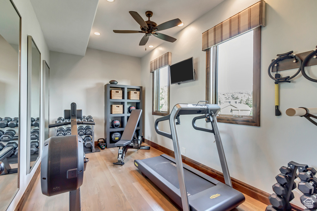 Exercise room featuring baseboards, a ceiling fan, recessed lighting, and wood finished floors