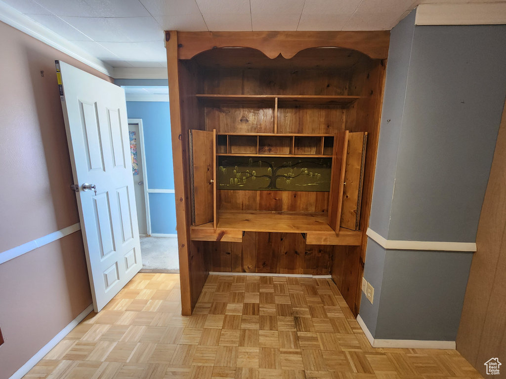 Mudroom featuring wood walls and baseboards