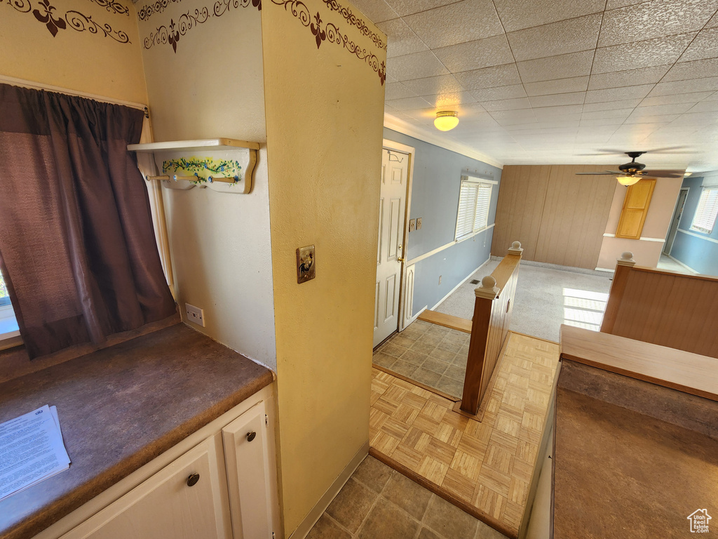 Hall featuring plenty of natural light and baseboards