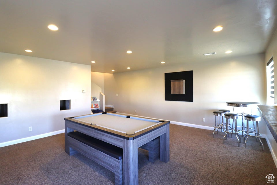 Playroom featuring dark colored carpet, pool table, baseboards, and recessed lighting