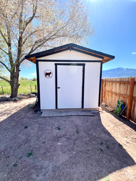View of shed with fence
